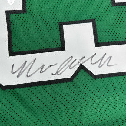 Green custom jersey with white number and autograph from a professional sports league