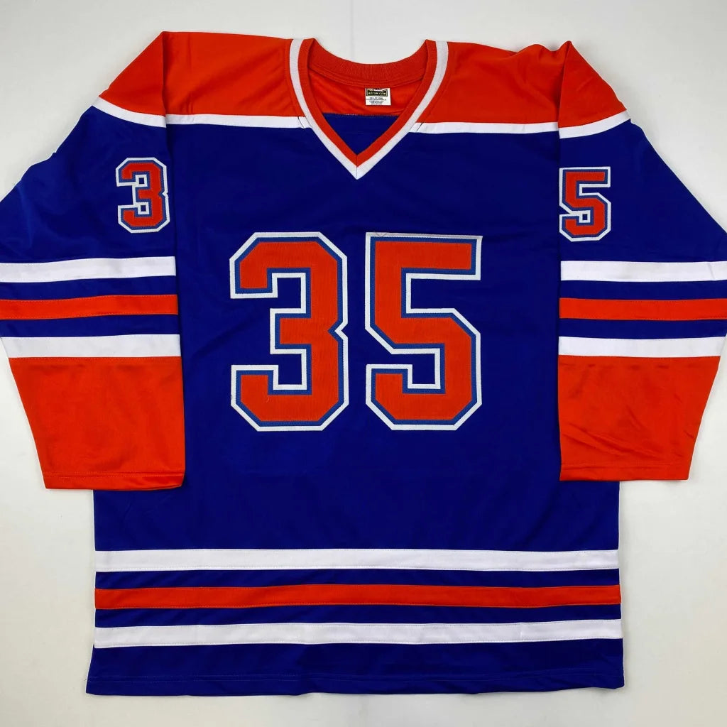 Blue and orange custom hockey jersey with number 35 from a pro sports league collectible