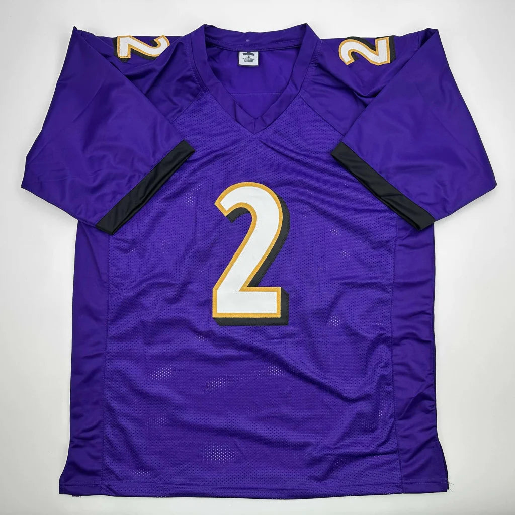 Purple custom jersey with gold-outlined number 2 for pro sports league