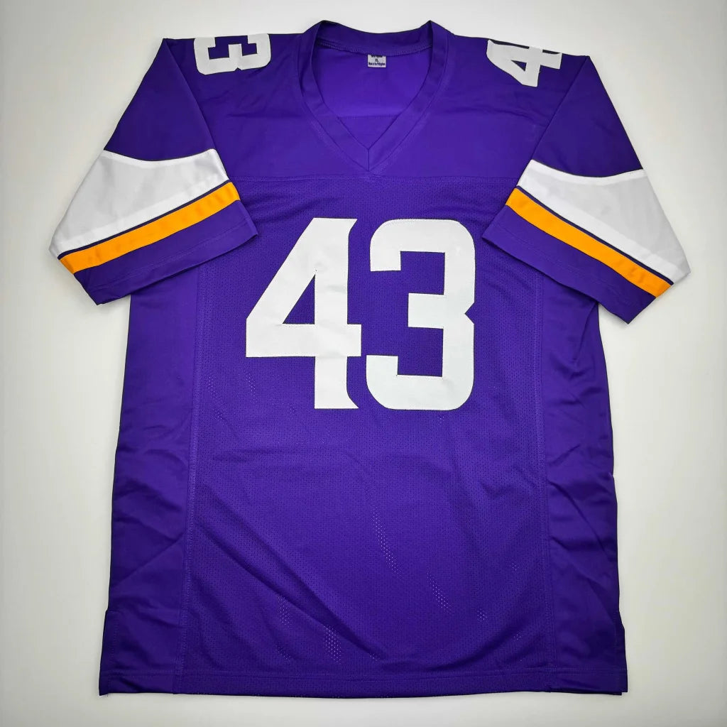 Purple custom jersey with white number 43, Reebok mesh, pro sports league collectible