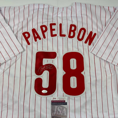 White pinstriped baseball jersey with red lettering, perfect for custom sports gear