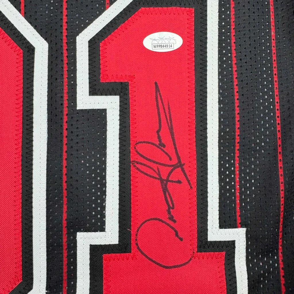 Black and red custom jersey with autograph and authentication sticker from professional sports league