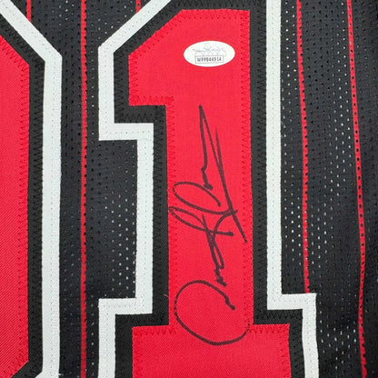 Black and red custom jersey with autograph and authentication sticker from professional sports league