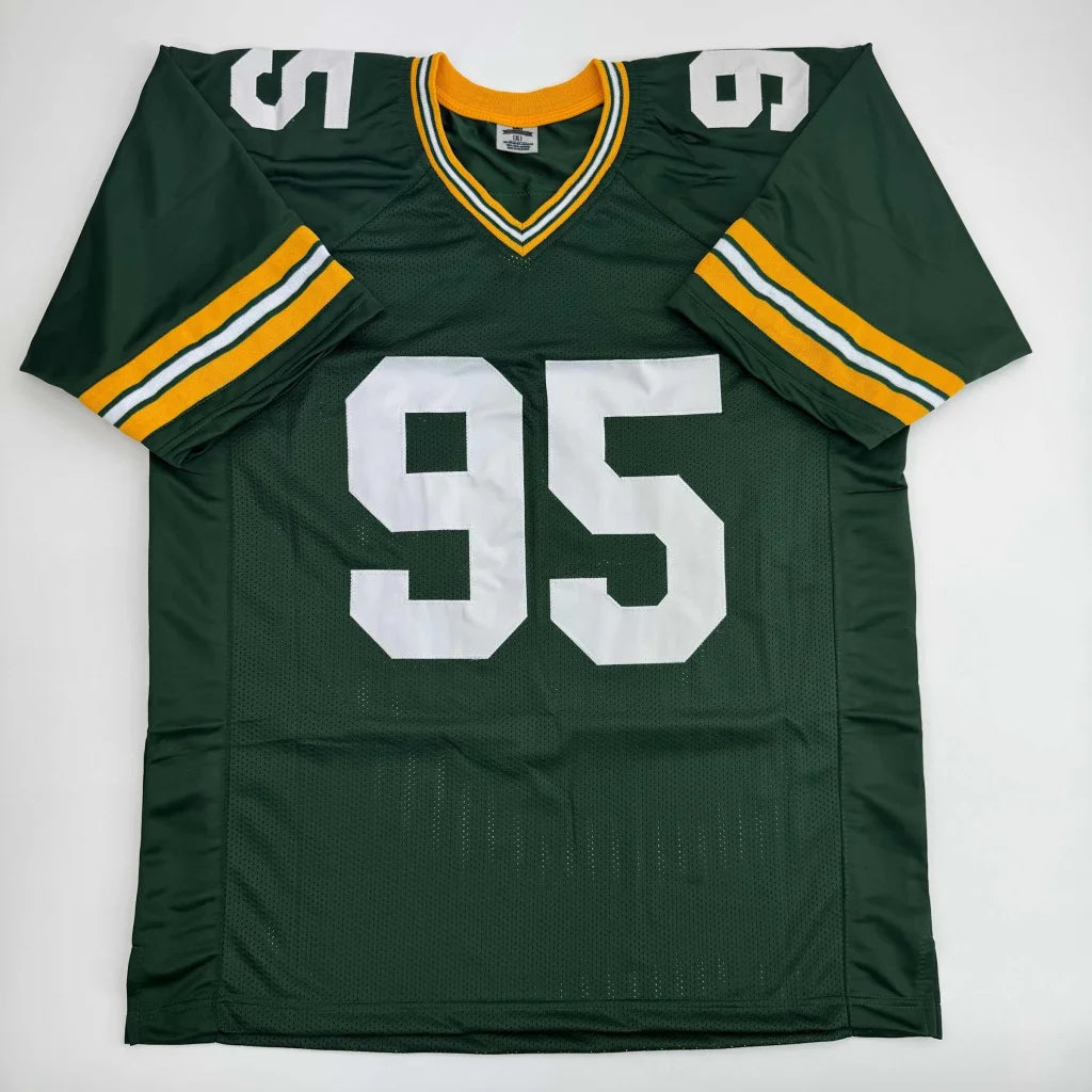 Custom green and gold jersey with white 95, Dunwoody Wyatt signed, Green Bay style