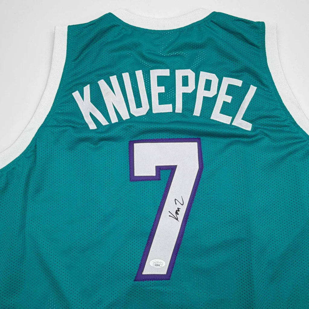 Green custom jersey signed by Knueppel #7, white purple accents