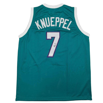 Green custom jersey with number 7, white lettering on mesh fabric