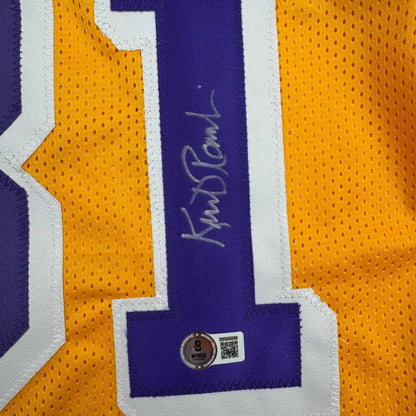 Custom jersey signed by Lakers legend Phil Jackson, yellow and purple with white accents