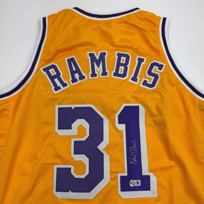 Autographed yellow purple Rambis Lakers jersey by Phil Jackson