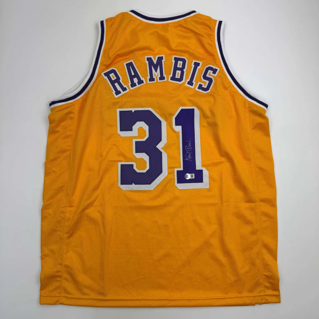 Custom Lakers jersey signed by Phil Jackson, yellow with purple accents