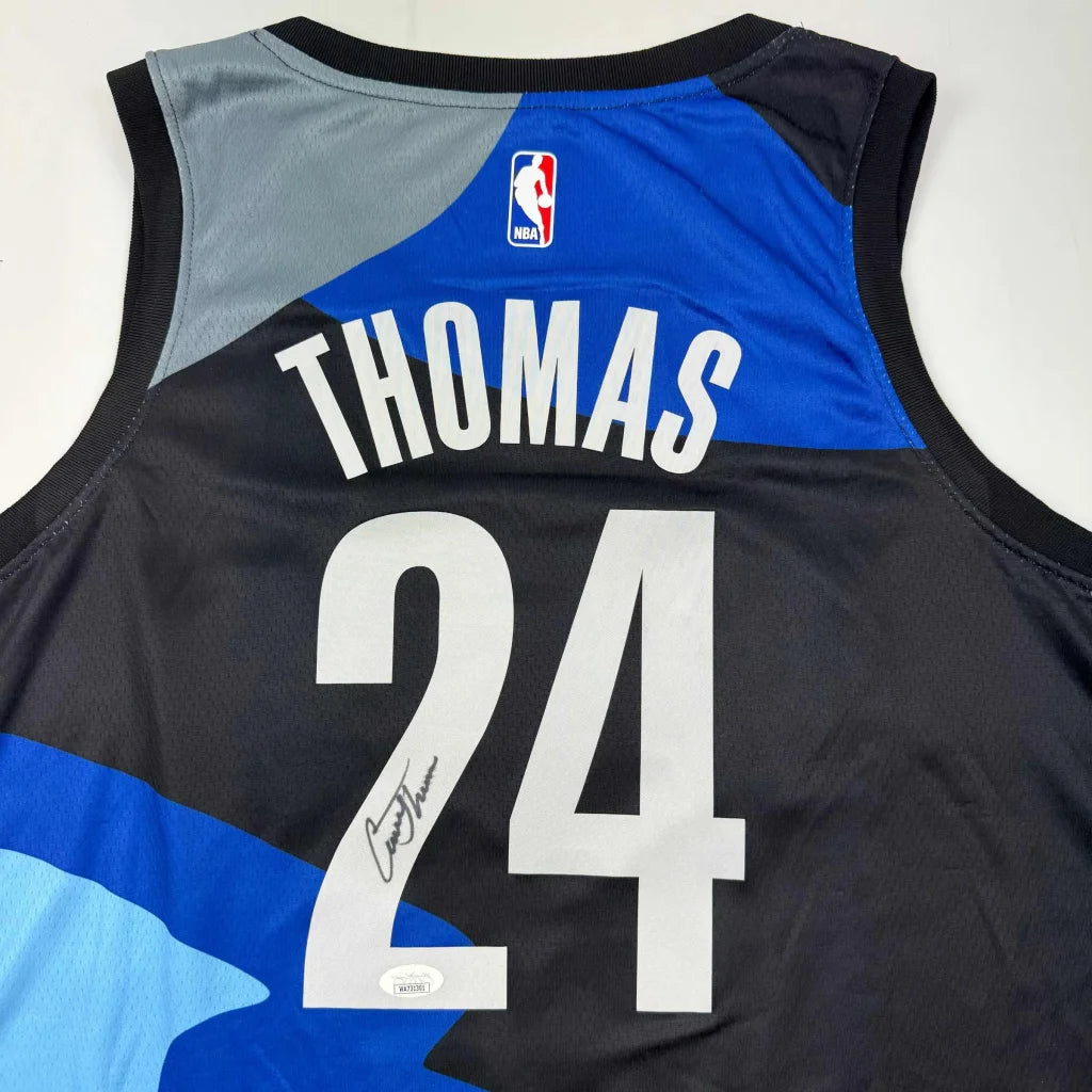Black and blue custom jersey with Thomas nameplate, NBA logo, number 24, signed by Paul Pierce