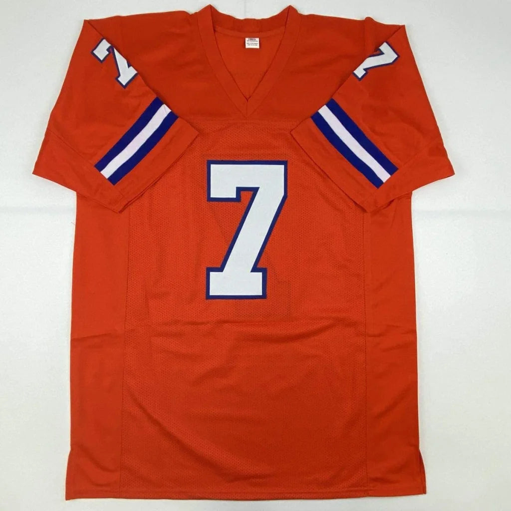 Orange custom football jersey with number 7 and blue shoulder stripes signed by NFL legends