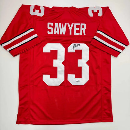 Red custom jersey signed by Sawyer with white lettering, pro sports league style