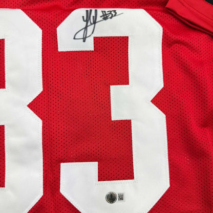 Red and white custom jersey signed by Sawyer for professional sports league