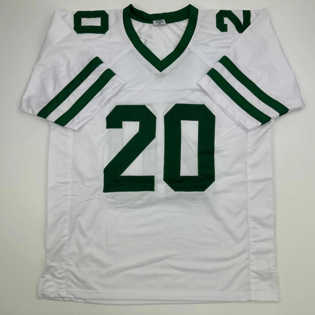 Custom white and green basketball jersey with number 20 signed by a pro sports team