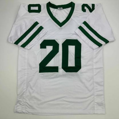 Custom white and green basketball jersey with number 20 signed by a pro sports team