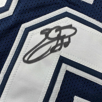 Autographed dark blue and white custom jersey from a professional sports league collectible