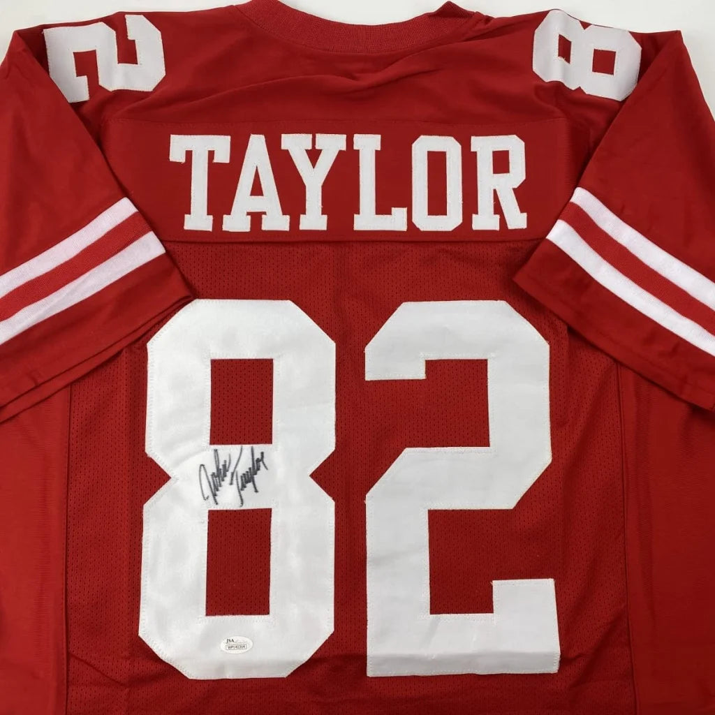 Autographed red custom jersey from a professional sports league showing player signature