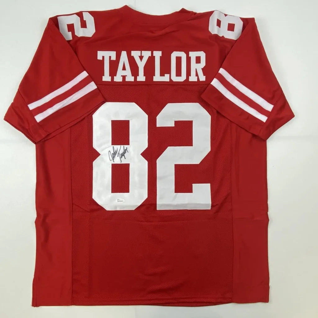 Autographed red custom jersey with TAYLOR 82 for football fans and pro sports collectors