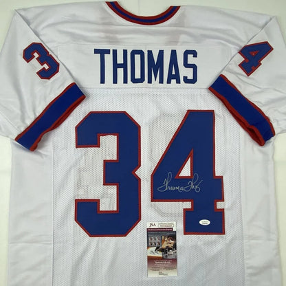 White custom jersey with blue and red accents from the Thomas 34 autographed football collectible in professional sports league