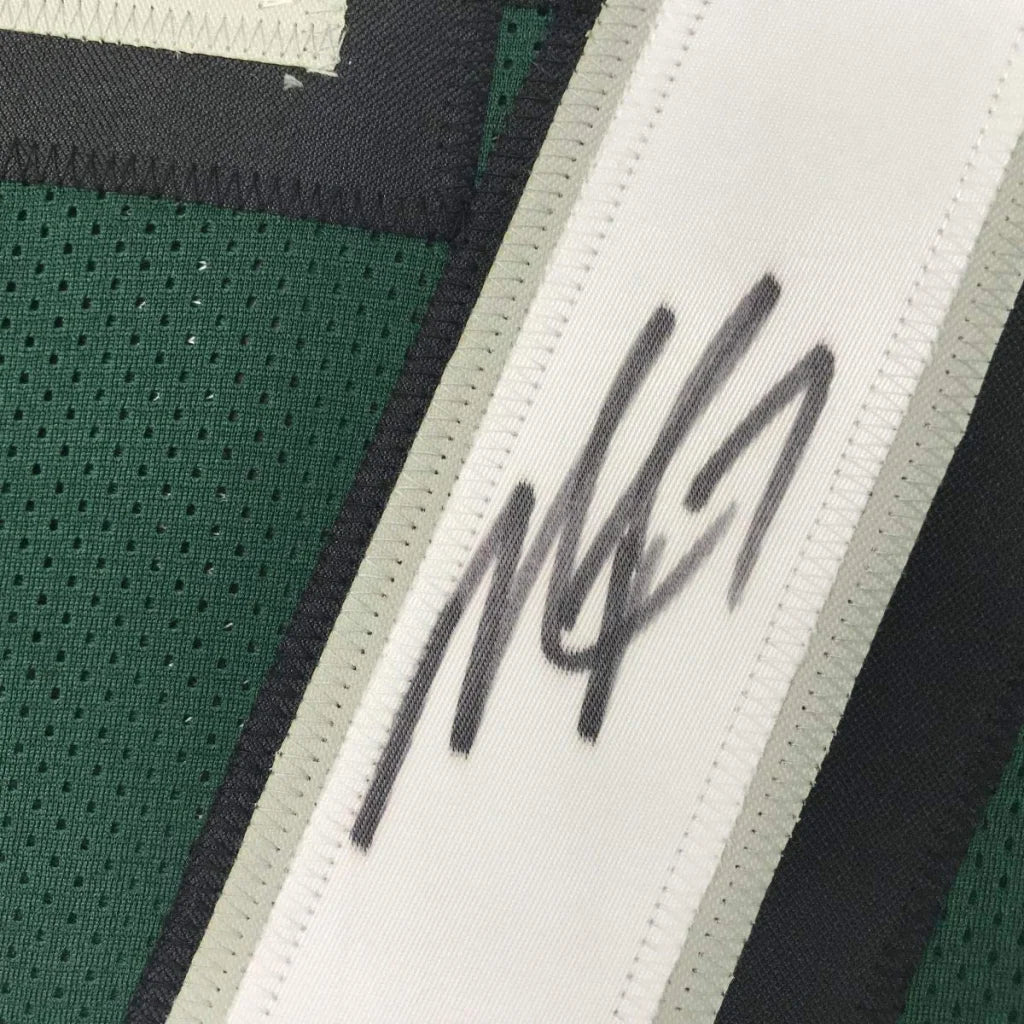 Signed green custom jersey with white and gray trim from VICK 7 football collectible