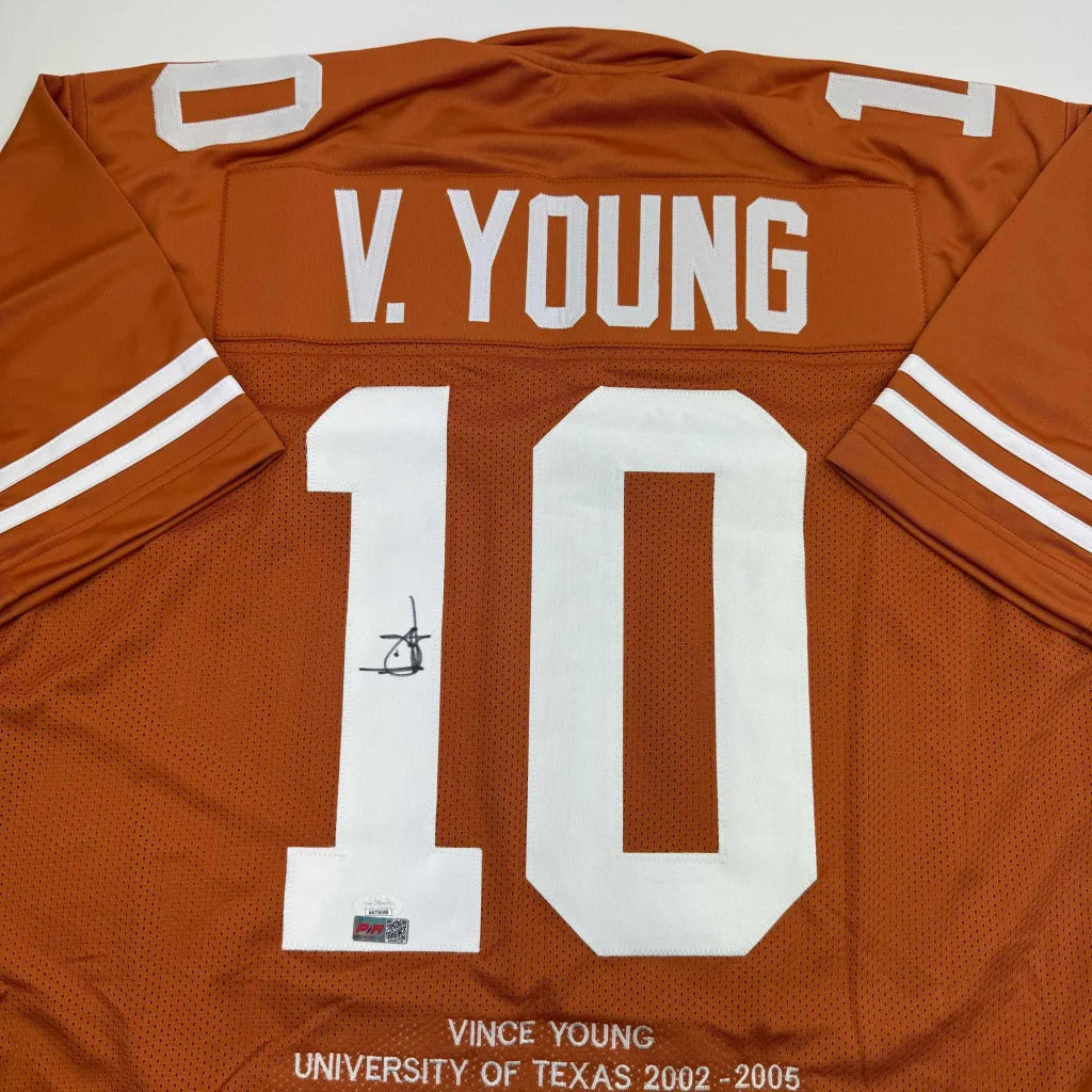 Orange custom jersey with number 10 and signature from Vince Young, Texas Longhorns sports collectible