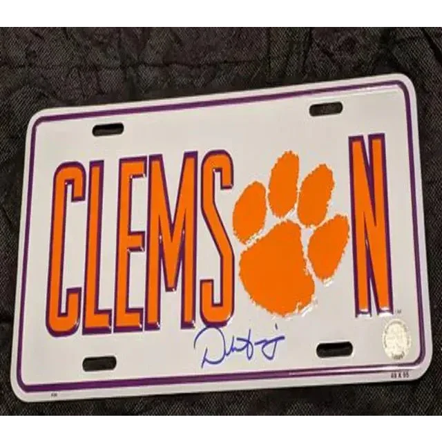 White and purple Clemson Tigers license plate with orange paw print, Dabo Swinney signed team collectible