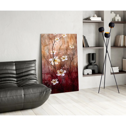 Stunning glass wall art of white blossoms on dark branches, warm brown to red gradient