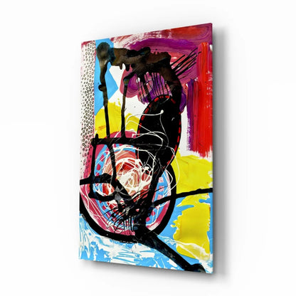 Vibrant abstract glass wall art with bold black, red, yellow, blue swirls