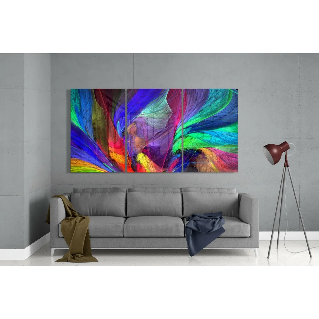 Vibrant rainbow swirl glass wall art triptych above gray sofa