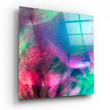 Iridescent dandelion glass wall art with pink purple hues on teal glow