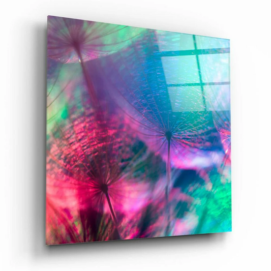 Iridescent dandelion glass wall art with pink purple hues on teal glow