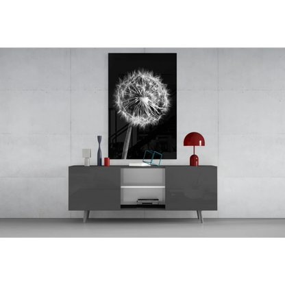 Black-and-white dandelion glass wall art on gray console