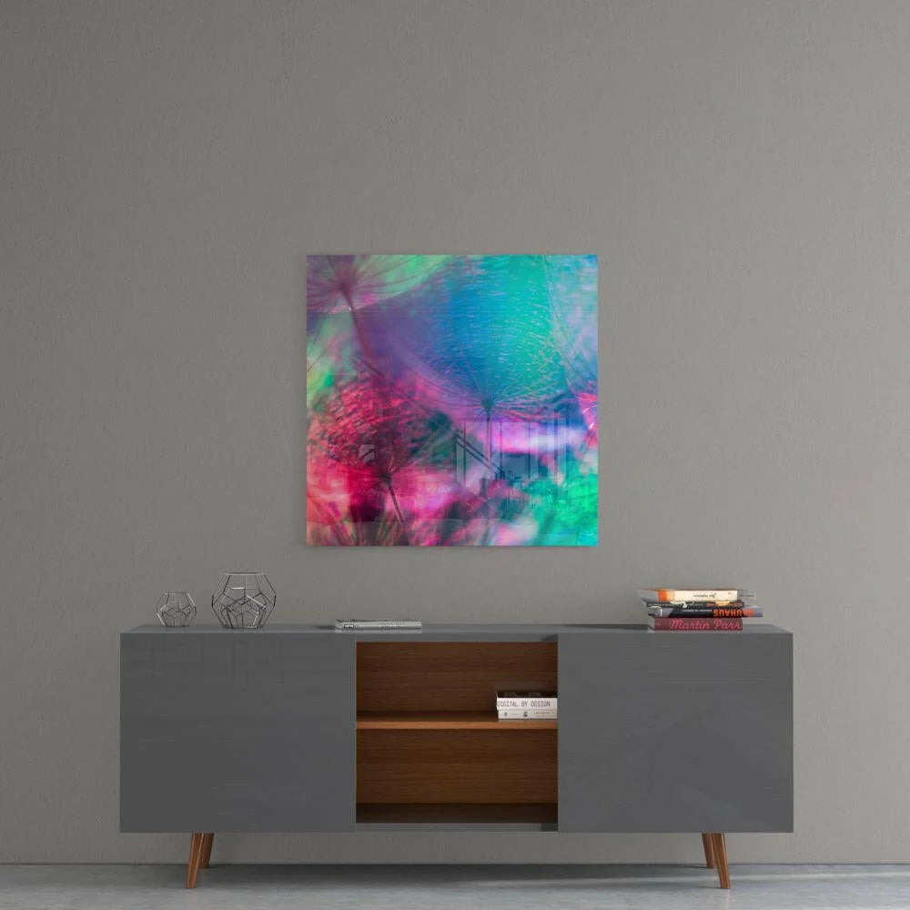 Vibrant iridescent dandelion glass wall art with swirling teal hues on gray console