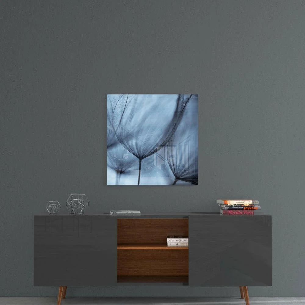 Blue-toned glass wall art of wispy dandelion stems in abstract fan design