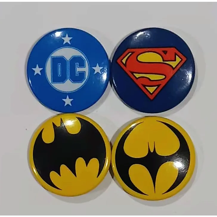Vibrant glossy DC superhero buttons with Batman and Superman logos
