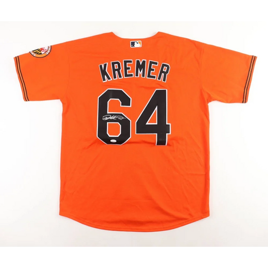 Orange baseball jersey with KREMER and 64, Dean Kremer signed Orioles collectible