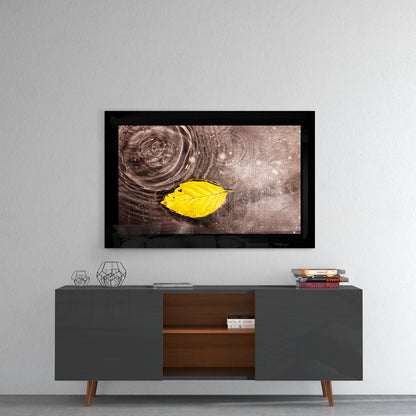 Yellow Leaf Floating On Rain Ripples Glass Wall Art