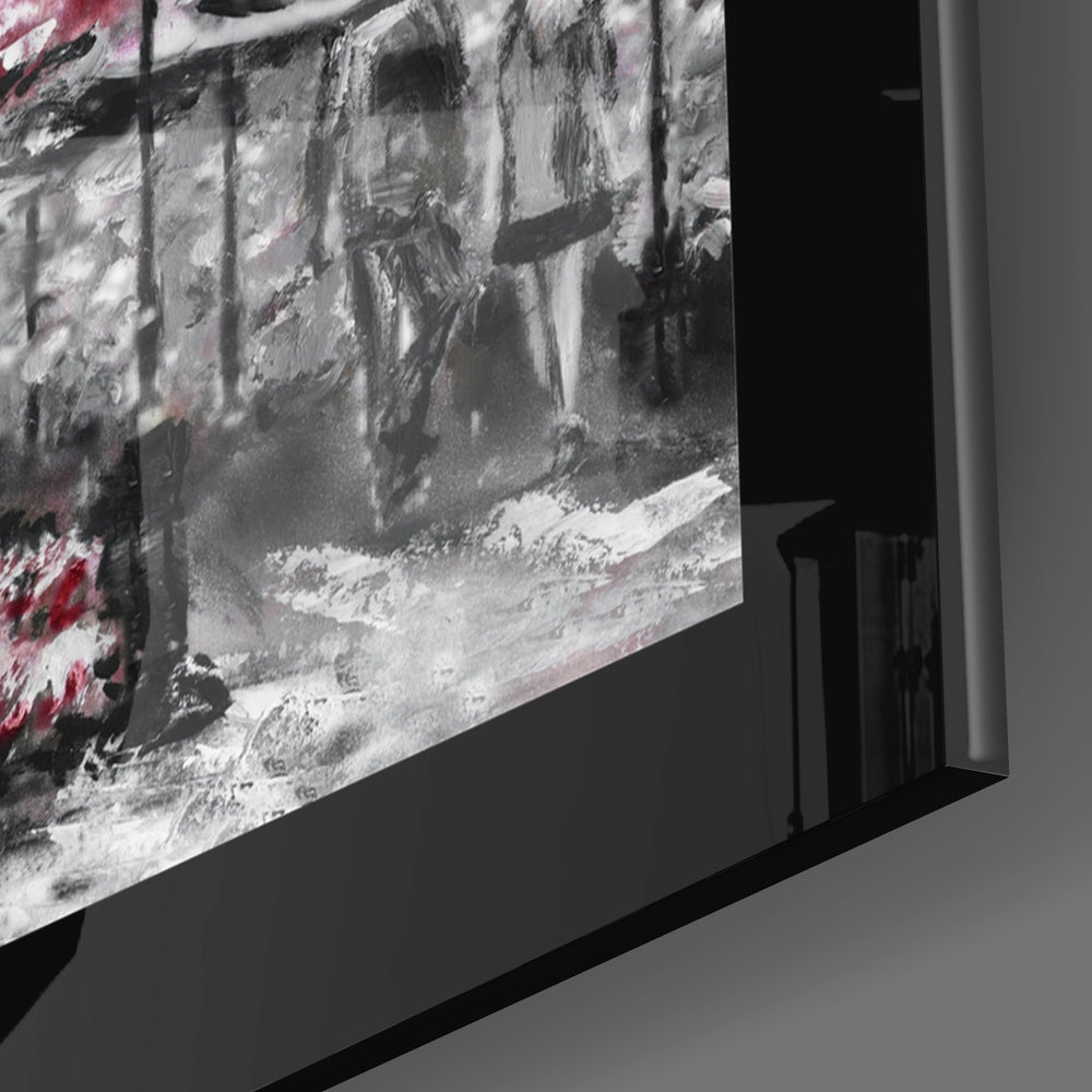 Close-up side profile of framed glass wall art displaying black and white photograph with pink accents and black frame edge.