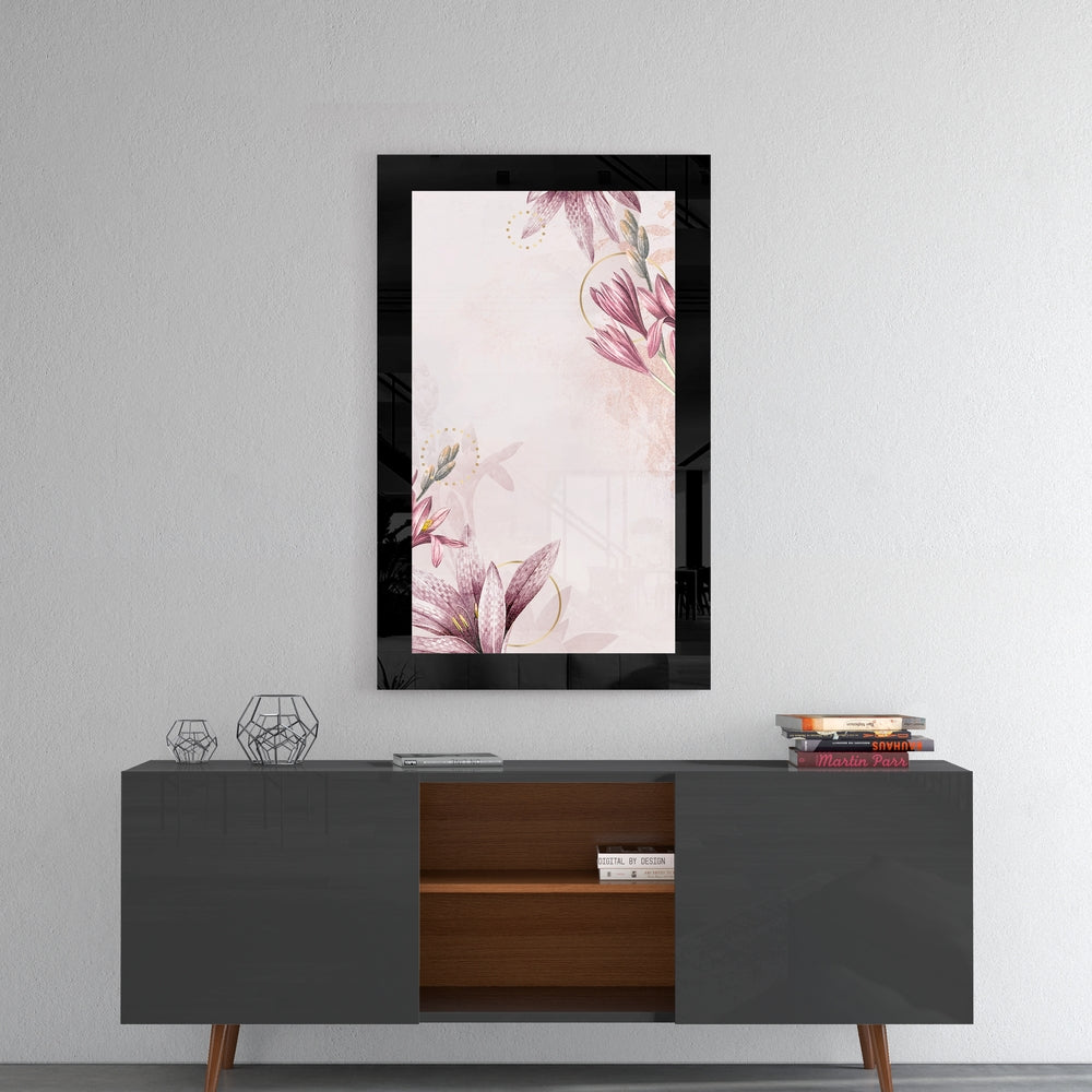 Black-framed glass wall art featuring pink watercolor flowers displayed above a mid-century modern console table.