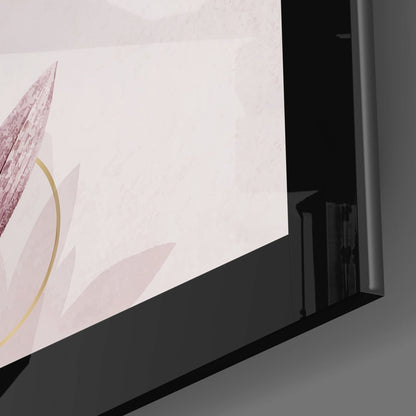 Angled close-up of Pinky Glass Wall Art showing pink floral design with gold accents on white background, mounted on gray wall.