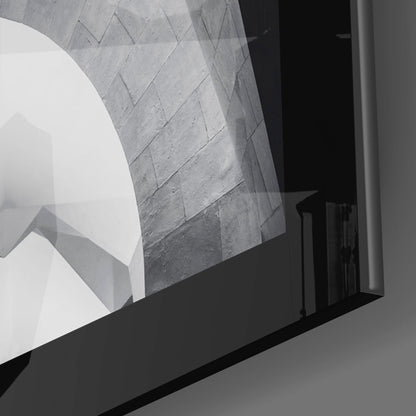 Close-up detail of etched glass wall art showing textured geometric pattern with diagonal lines and monochromatic gray tones.