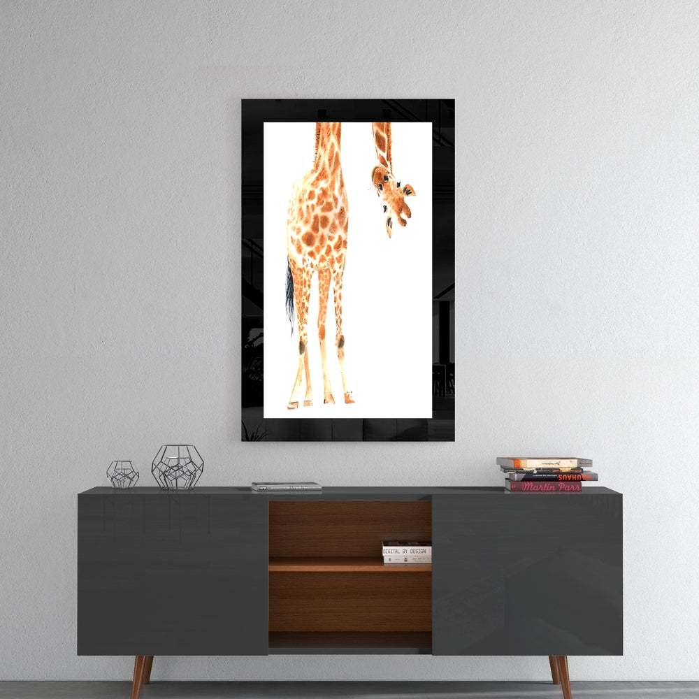 Framed glass wall art depicting a giraffe's rear view with spotted orange and tan coat hanging above a modern console table.