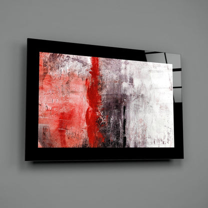 Black-framed red and white abstract glass wall art mounted on gray wall, angled view showing depth and reflection.