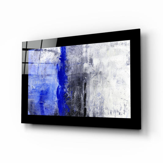 Black-framed glass wall art mounted at an angle displaying abstract cobalt blue vertical stripe on white and gray textured background.