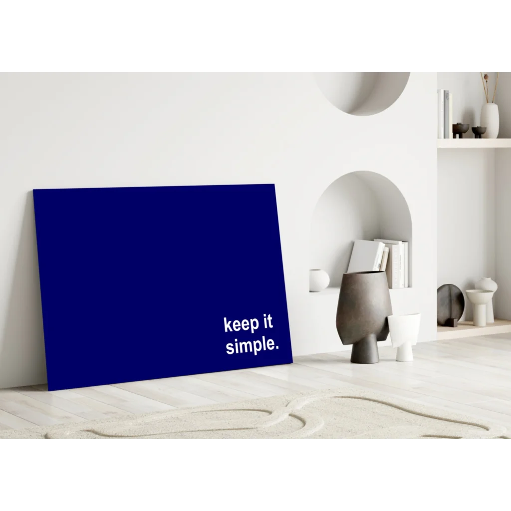 Deep blue minimalist canvas wall art print with keep it simple text