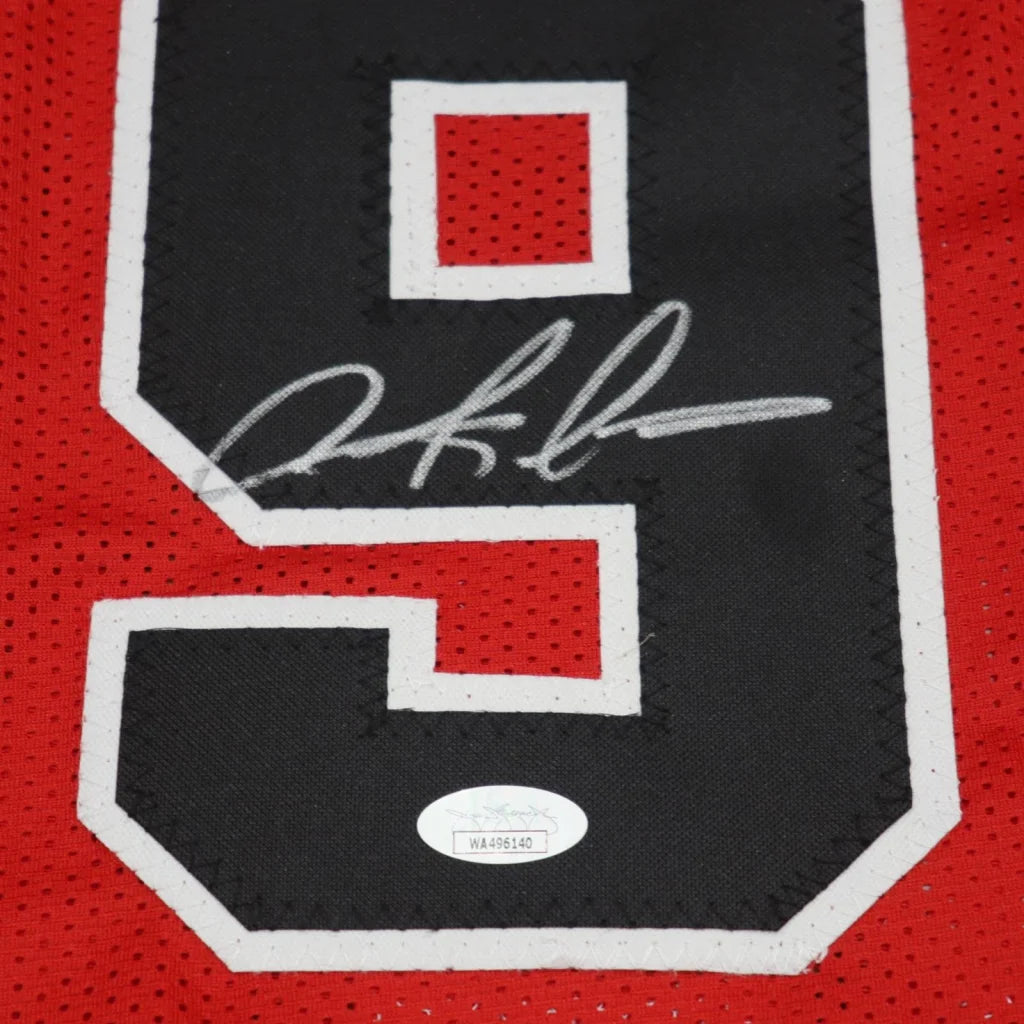 Autographed Chicago Bulls red black mesh jersey #91 back with signature over 9