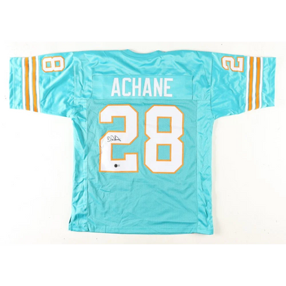 Teal Miami Dolphins signed jersey with white and orange trim featuring De’von Achane