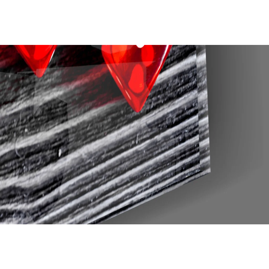 Vibrant red glossy glass heart picks wall art on black wood panel
