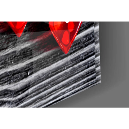 Vibrant red glossy glass heart picks wall art on black wood panel