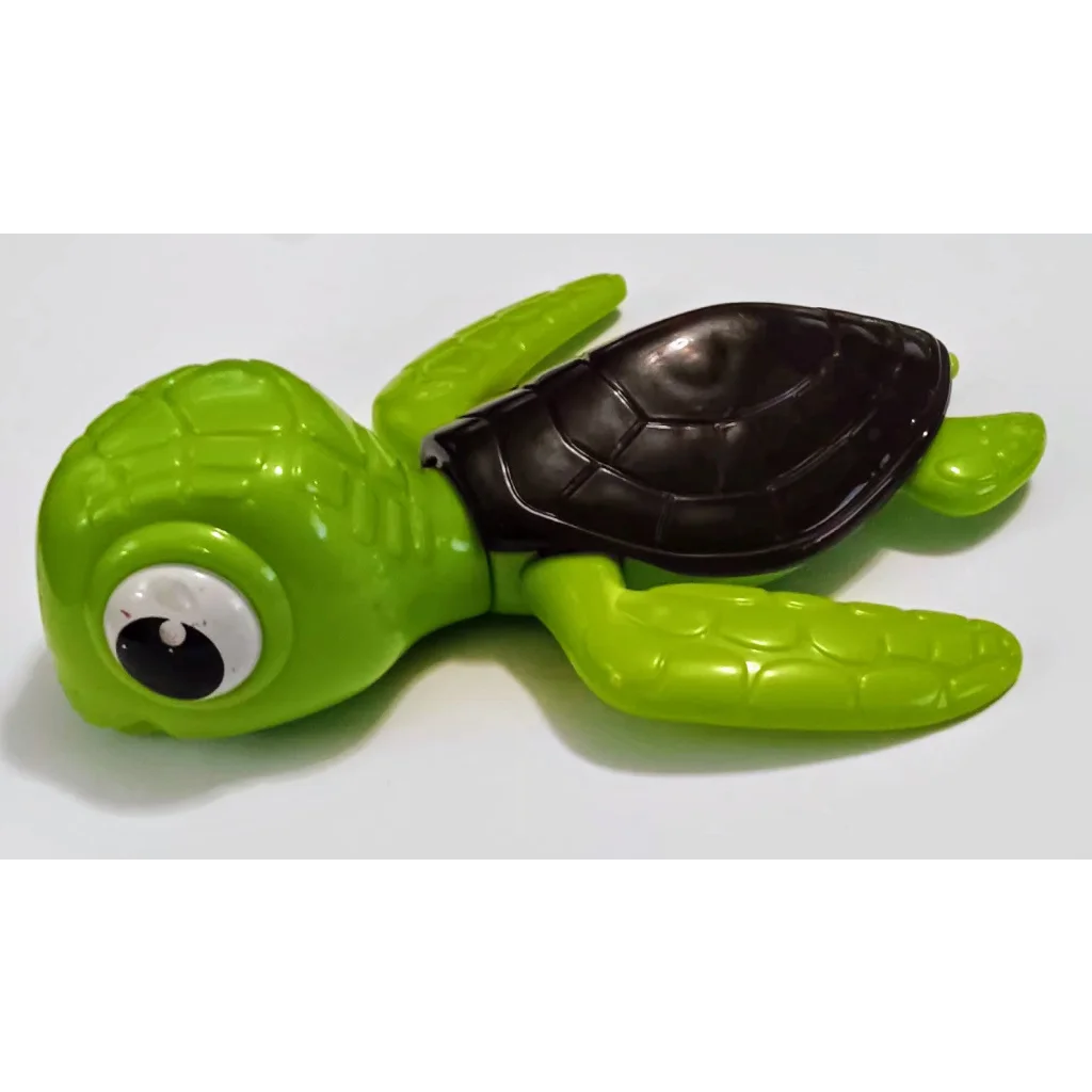 Green Crush Disney Happy Meal toy: plastic turtle with black shell and googly eyes